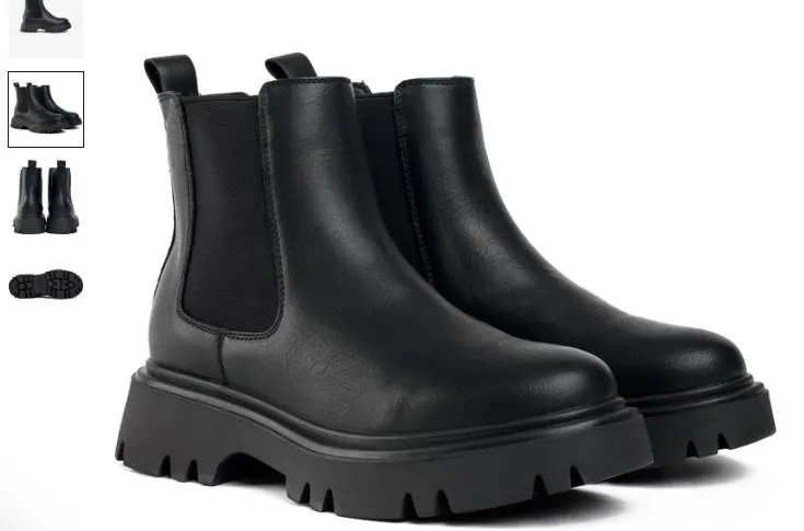 A pair of black leather Chelsea boots featuring a zipper, labeled as the Russ Vegan Chelsea Boots by V.GAN.