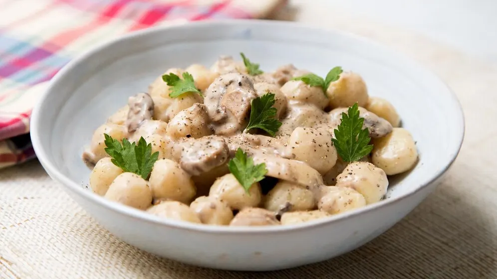 Italian gnocchi with mushrooms cream traditional italian recipe