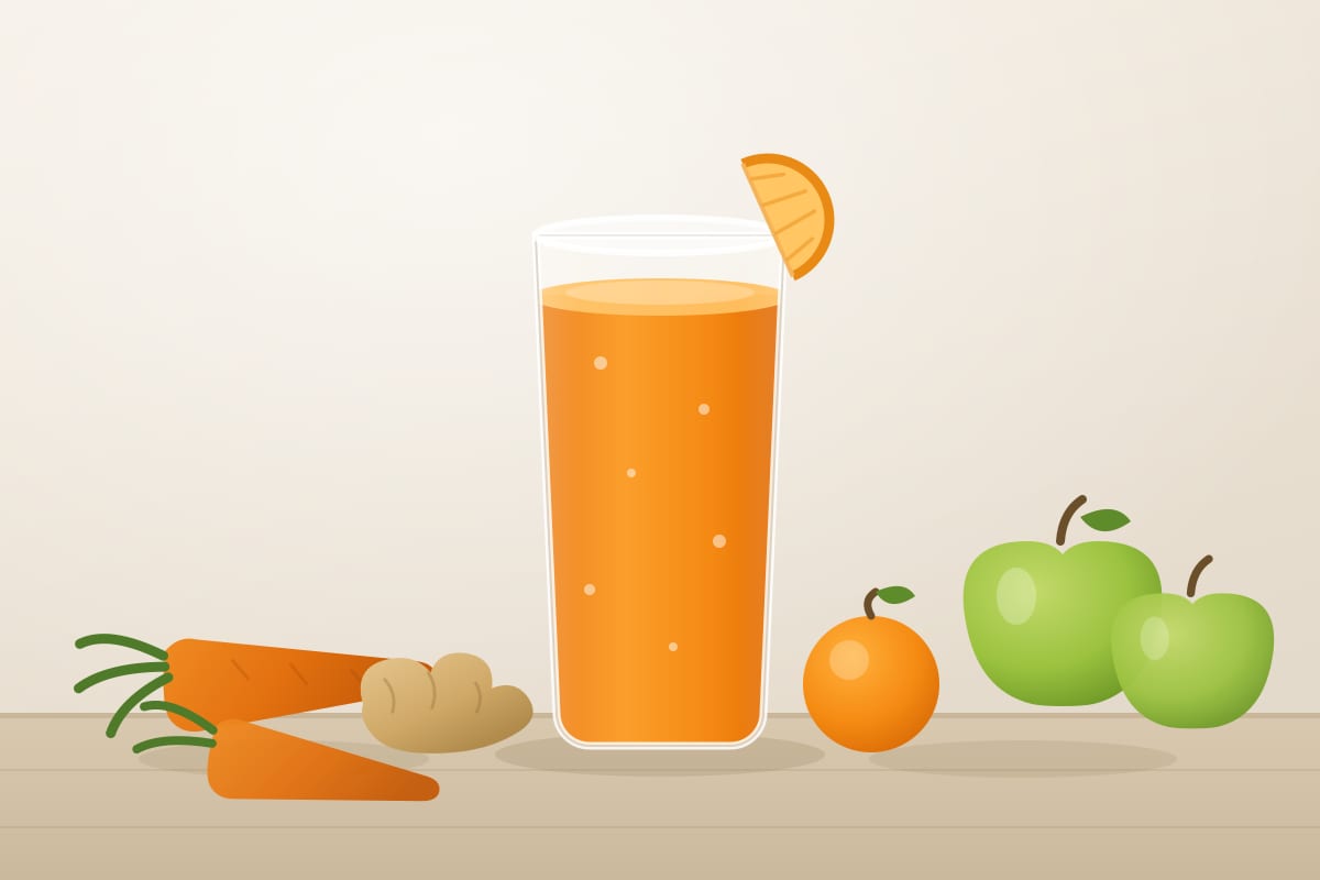 A tall glass of bright orange juice with carrots, green apples, an orange and fresh ginger on the bench beside it