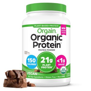 A container of Orgain Organic Vegan Protein Powder features a creamy chocolate fudge flavor. The packaging highlights "21g plant protein," "150 calories," "