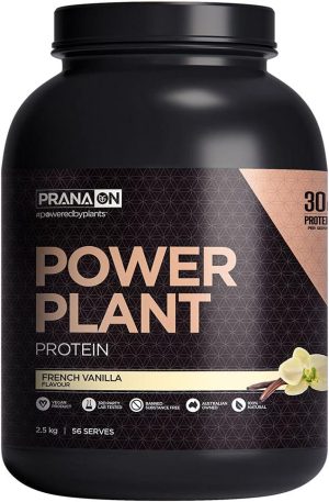 A black container of PranaON Power Plant Protein in French Vanilla flavor showcases 30g of protein per serving. With a net weight of 2.5 kg, it offers 56 servings and features an elegant vanilla flower and bean image on the label.