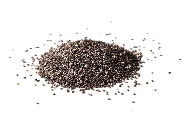 "A pile of black chia seeds on a white background, showcasing their small size and rich texture, representing a nutritious superfood high in fiber, protein, and omega-3 fatty acids."