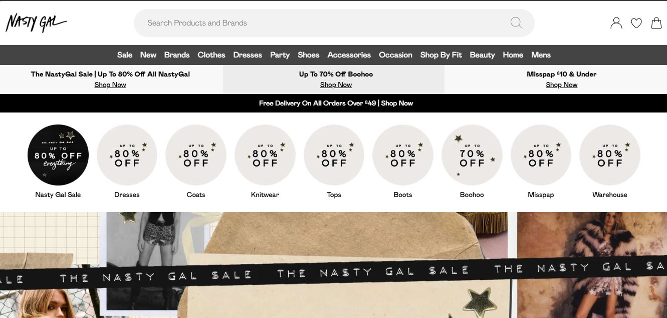 The Nasty Gal website featuring a collection of chic vegan leather fashion pieces and contemporary styles.