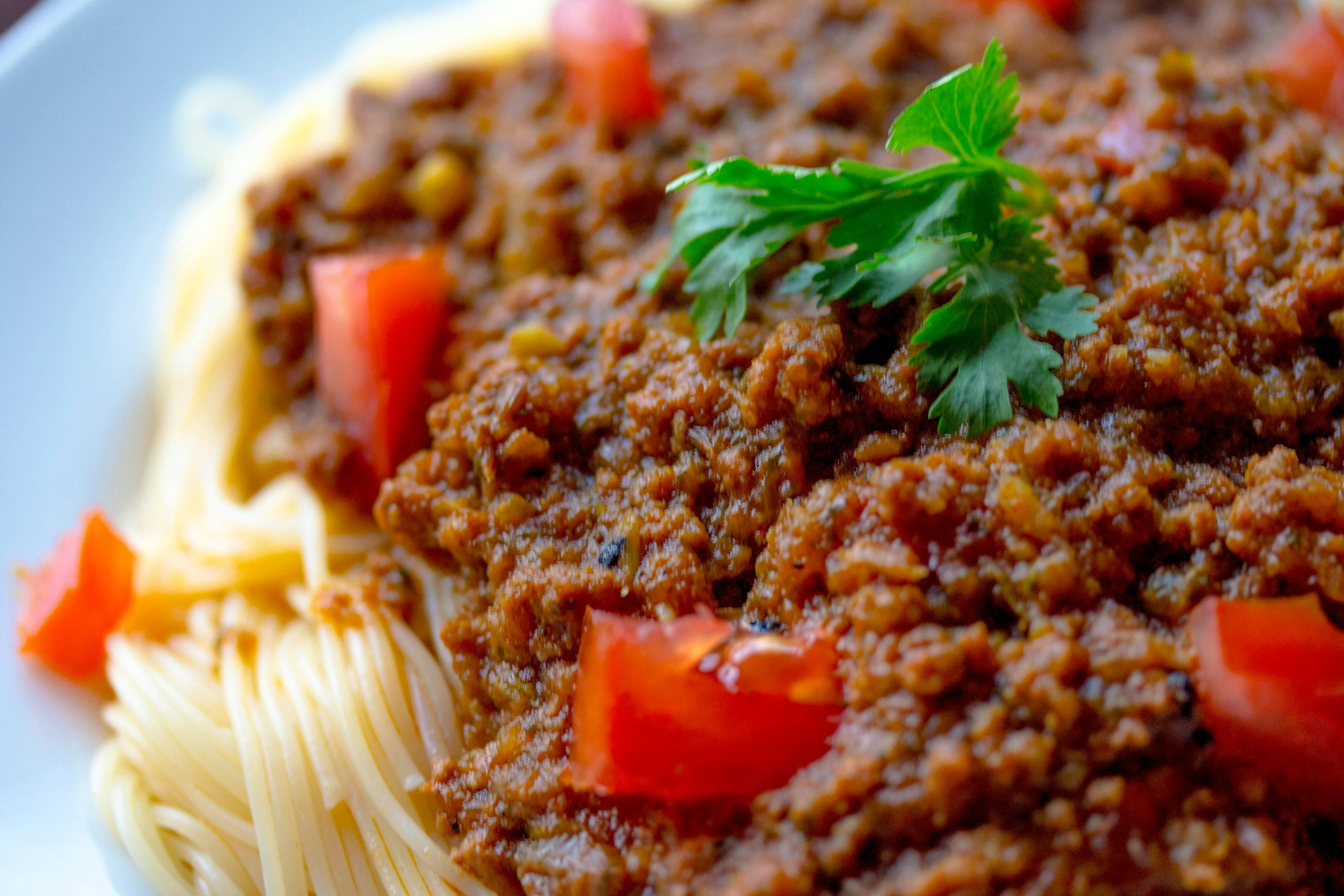 A delicious serving of spaghetti adorned with meat sauce, featuring a quick and easy vegan lentil bolognese recipe.