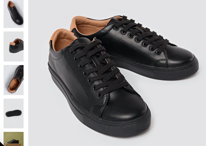 A black leather sneaker featuring a lace-up front, the R-Kind Trainer - Mercury Black by Ration.L.