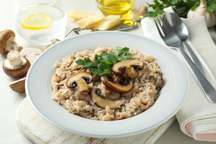Creamy vegan mushroom risotto topped with parmesan cheese and fresh parsley, showcasing a delicious and hearty meal.