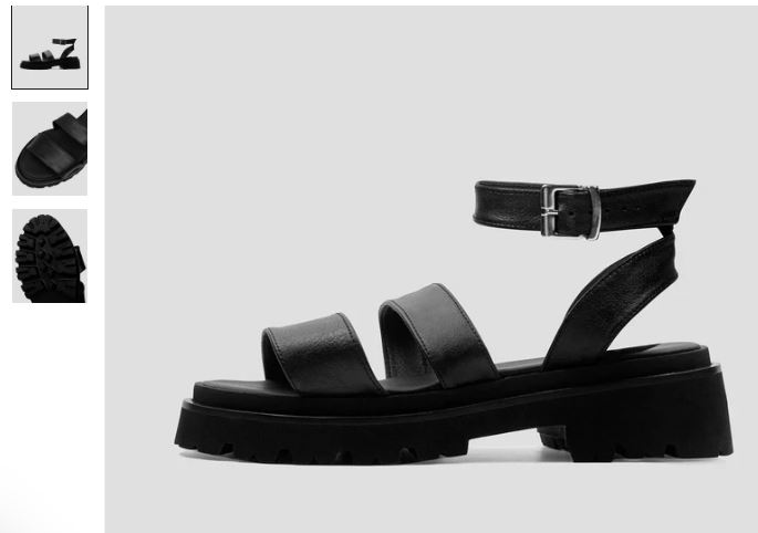 Black strappy sandals with a buckle, crafted from Desserto® cactus leather by Bohema, showcasing sustainable fashion.