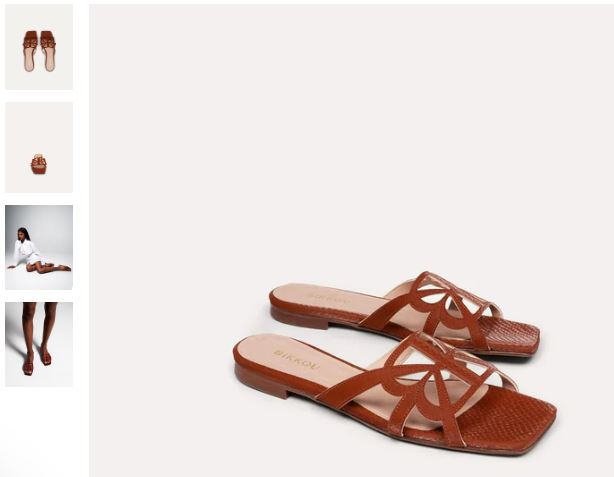 A pair of brown vegan sandals with cutouts, designed for comfort, perfect for a sunset beach outing.
