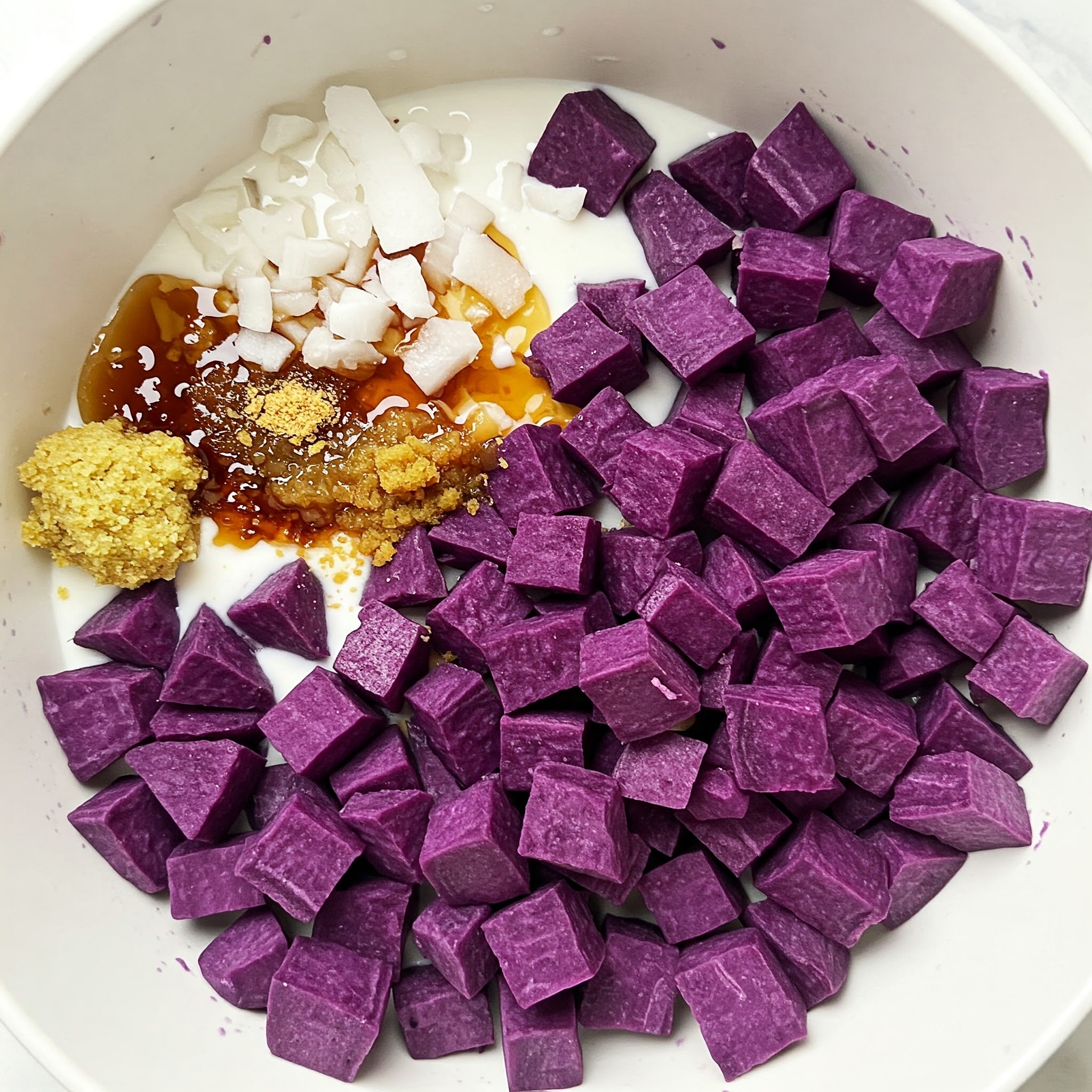 Purple sweet potato cubes arranged in a bowl, ideal for celebrating Valentine's Day with The Great Purple Sweet Potato Pie.