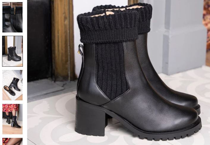 Black Zodiac Vegan High-Ankle Boots by Minuit sur Terre featuring a zipper and a cozy sock design.