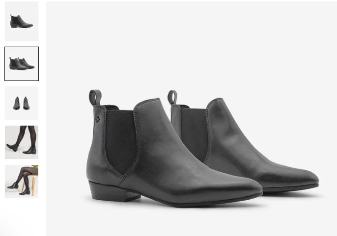 A pair of black leather Chelsea boots, the Laika Vegan Ankle Boots by COG, showcasing a sleek and stylish design.