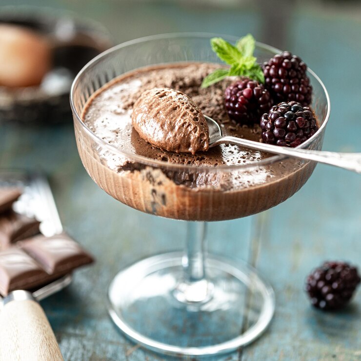A decadent Chocolate Raspberry Parfait topped with fresh blackberries and mint, perfect for a romantic Valentine's Day dessert.