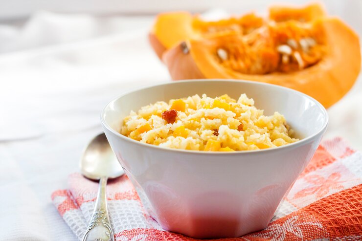 A colorful dish of pumpkin rice with crunchy pumpkin seeds, representing a delightful Valentine's Butternut Squash Risotto.