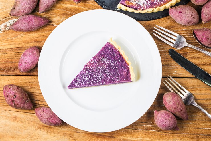 A slice of purple filling pie on a plate, perfect for celebrating Valentine's Day with The Great Purple Sweet Potato Pie.