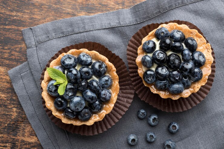 A charming blueberry tartlet featuring cream cheese and fresh blueberries, ideal for celebrating Valentine's Day.