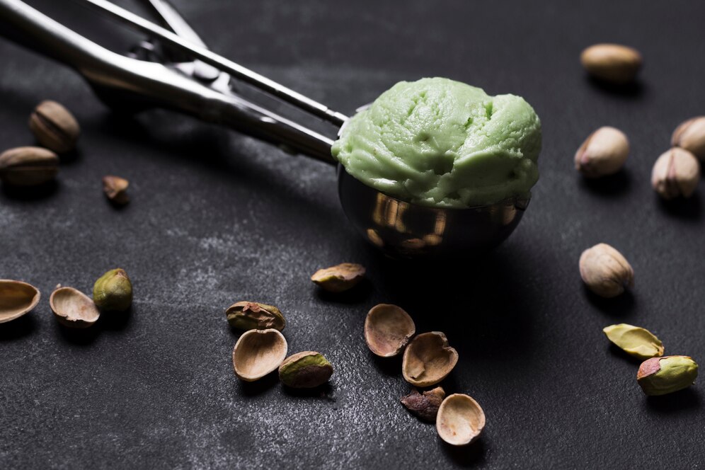 Creamy pistachio ice cream topped with whole pistachio nuts, featured in a viral vegan recipe.